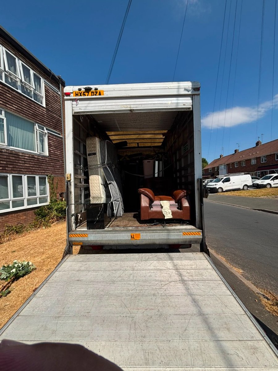 Jimmys Removals 3.5T Luton box van with electric hydraulic tail-lift lowered for ground-level loading on a UK street in Birmingham